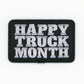 Rectangular black embroidered Happy Truck Month patch with white text on a white background
