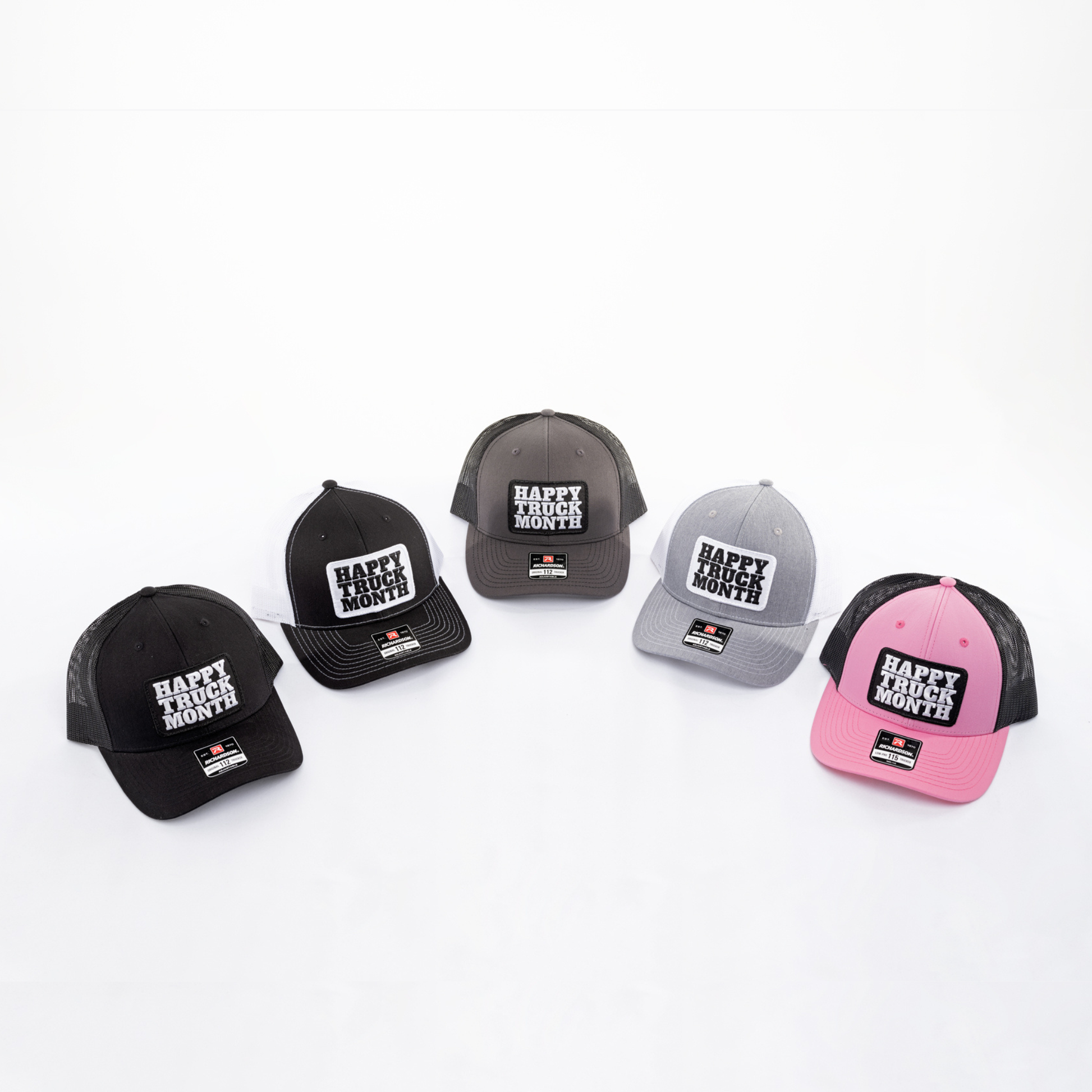 Set of six caps with 'Happy Truck Month' text on a white background
